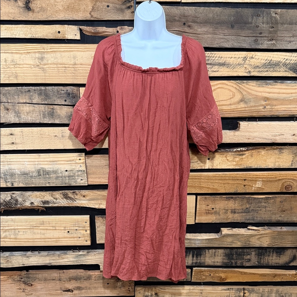 Naif burnt orange dress with lace-focused, cuffed, three-quarter length sleeves